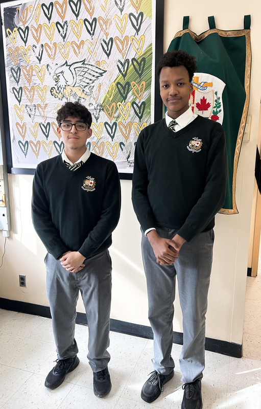 Photo of Emmanuel and Adair standing together in their Chaminade school uniforms