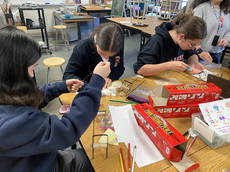 Photo of students working on their beading