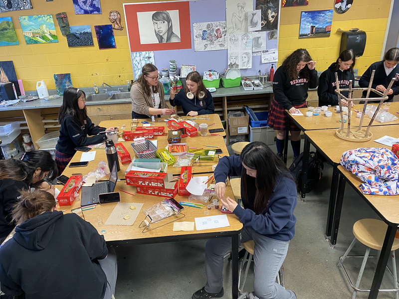 Photo of students working on their beading