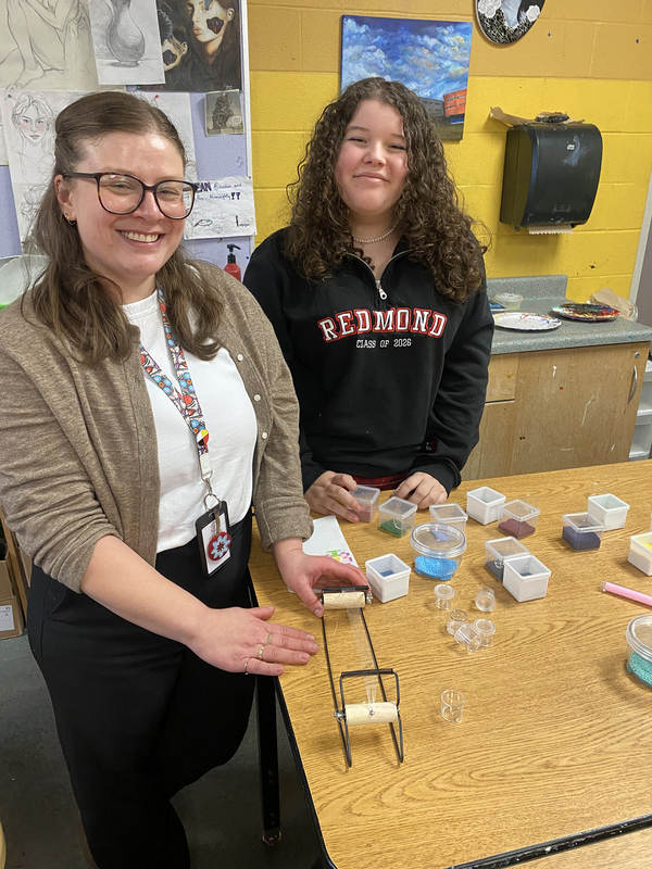 Photo of students working on their beading