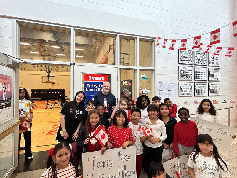 Photo of Fred Fox with St. Andre students and staff