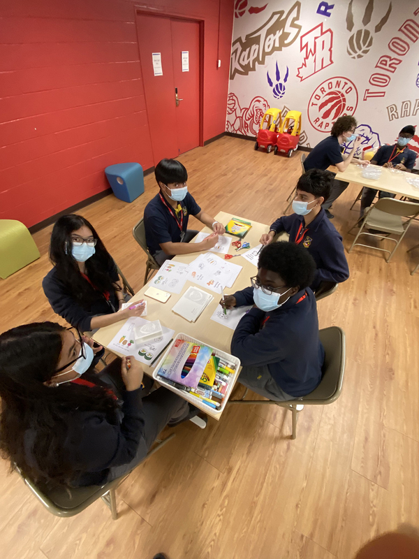 Photo of St. Basil-the-great students making the care packages