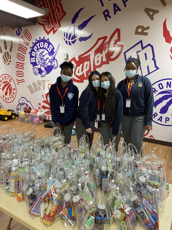 Photo of St. Basil-the-great students with the care packages they made