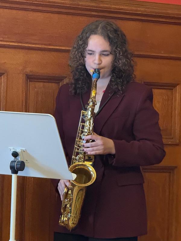 A student playing the sax