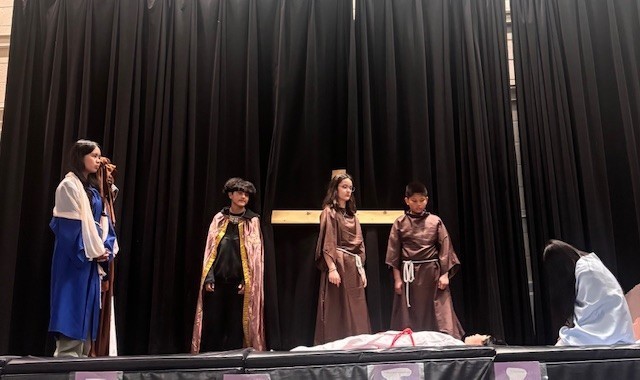 Photo of Blessed Trinity students performing the Stations of the Cross