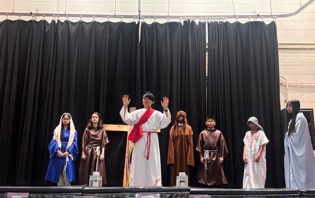 Photo of Blessed Trinity students performing the Stations of the Cross