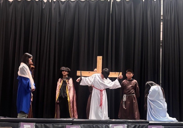 Photo of Blessed Trinity students performing the Stations of the Cross