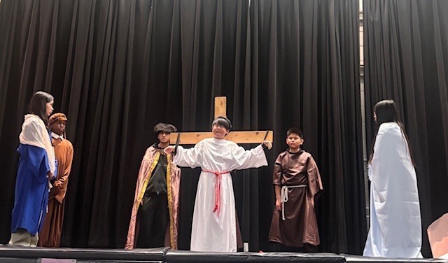 Photo of Blessed Trinity students performing the Stations of the Cross