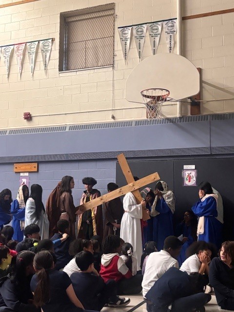 Photo of Blessed Trinity students performing the Stations of the Cross