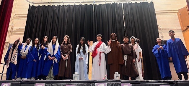 Photo of Blessed Trinity students performing the Stations of the Cross