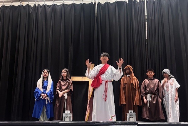 Photo of Blessed Trinity students performing the Stations of the Cross