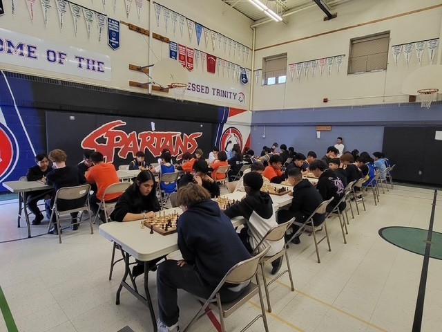 Blessed Trinity students playing chess at the tournament