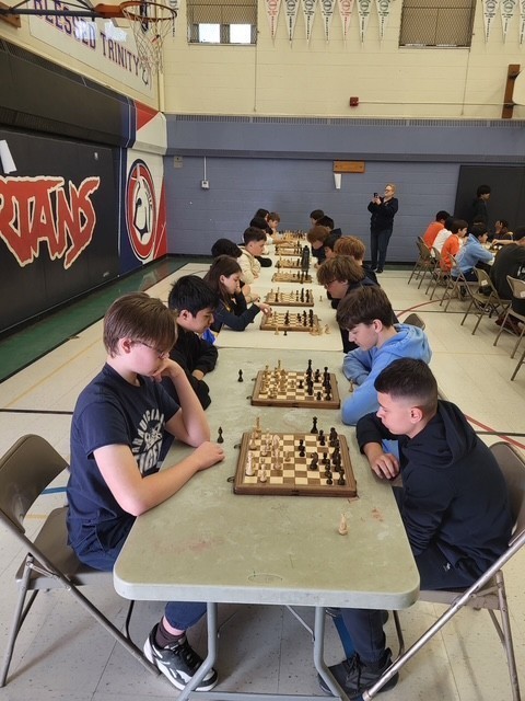 Blessed Trinity students playing chess at the tournament