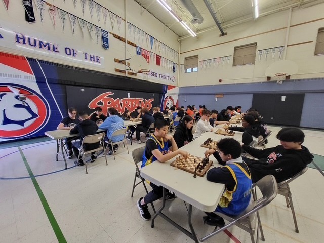 Blessed Trinity students playing chess at the tournament