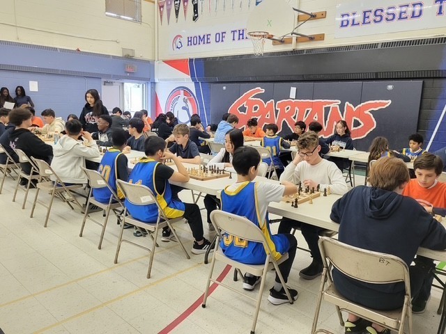Blessed Trinity students playing chess at the tournament