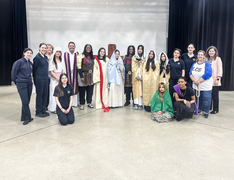 Group photo of the Stations of the Cross performers as well as helping students and staff