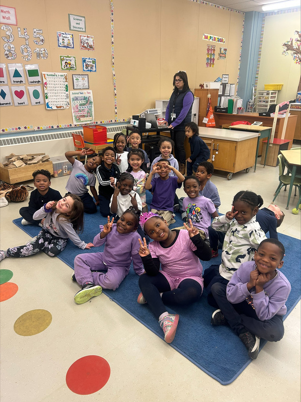 Photo of students wearing purple for Dress Purple Day