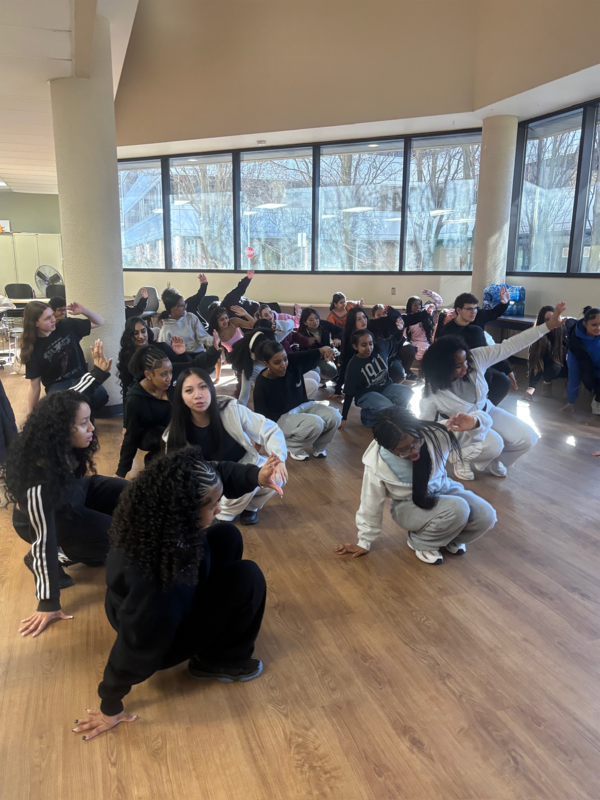 Photo of Newman students breakdancing during the session