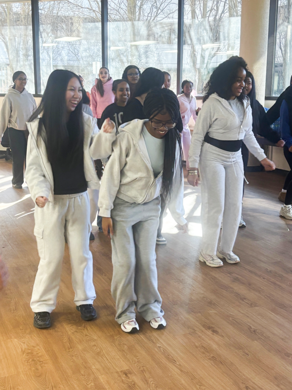 Photo of Newman students breakdancing during the session