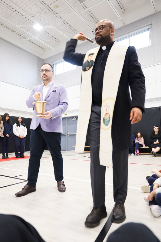 Photo of the gym being blessed by the pastor