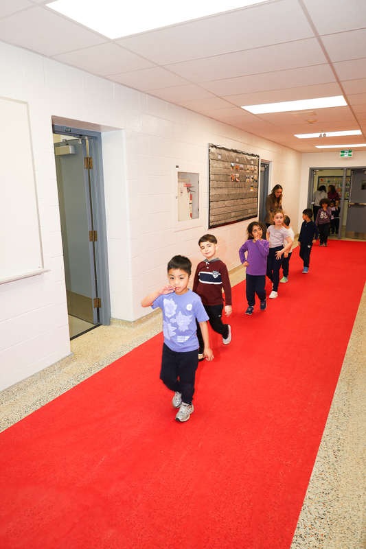 Photo of students heading out to the Blessing assembly