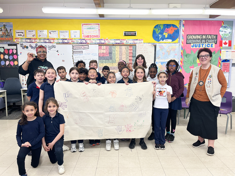 Group photo of students with Ms. Balthazaar and Diane Montreuil