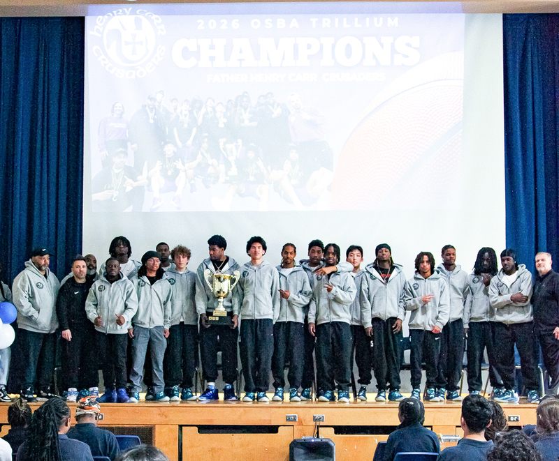 Group photo of the Senior Prep Basketball team with their trophy
