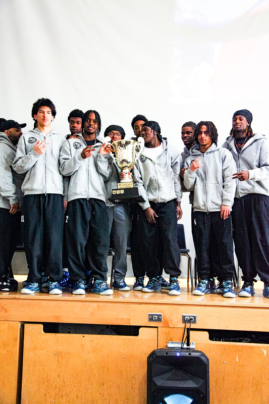 Group photo of the Senior Prep Basketball team with their trophy