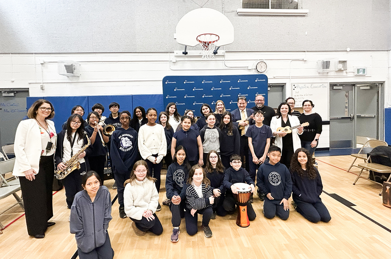 Photo of St. Norbert students and staff with the donated musical instruments