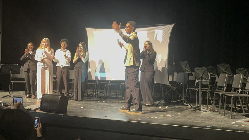 Photo of Chibu speaking on the stage about his campaign