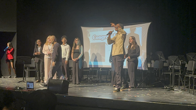 Photo of Chibu speaking on the stage about his campaign