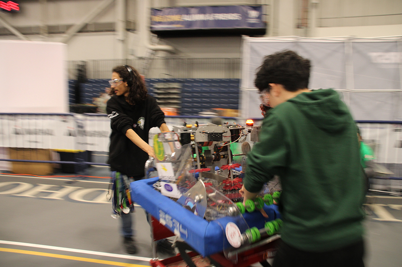Photo of the Chaminade Robotics team with the machine that they built