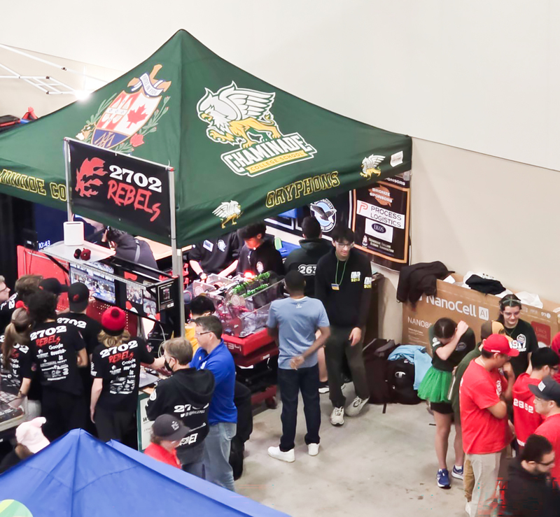 Photo of the Chaminade Robotics team with the machine that they built