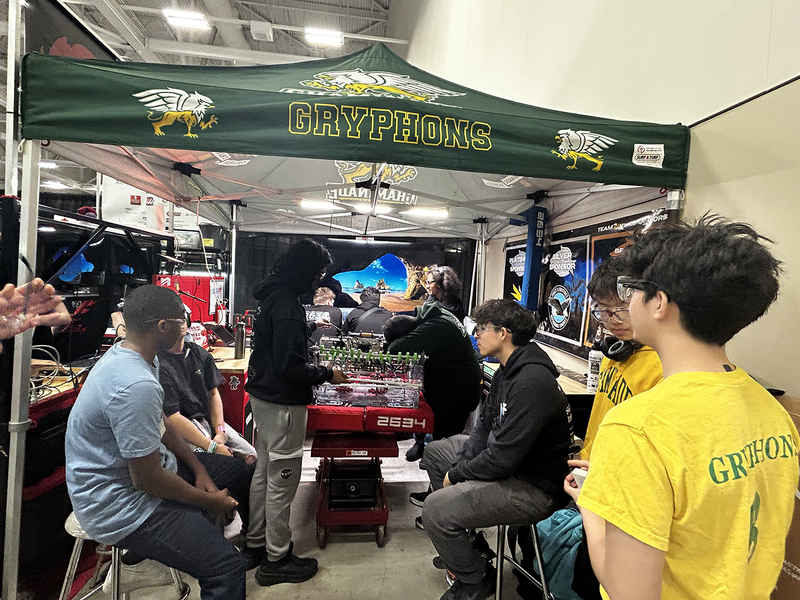 Photo of the Chaminade Robotics team with the machine that they built