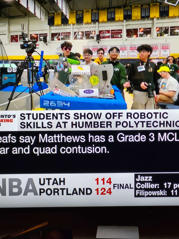 Photo of the Chaminade Robotics team with the machine that they built