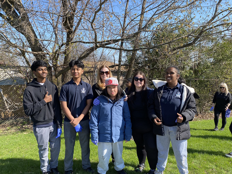 Photo of SJOA students in the school grounds during the cleanup