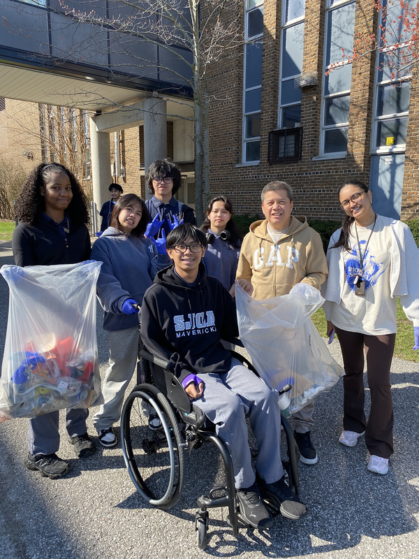 Photo of SJOA students with the garbage they cleaned up