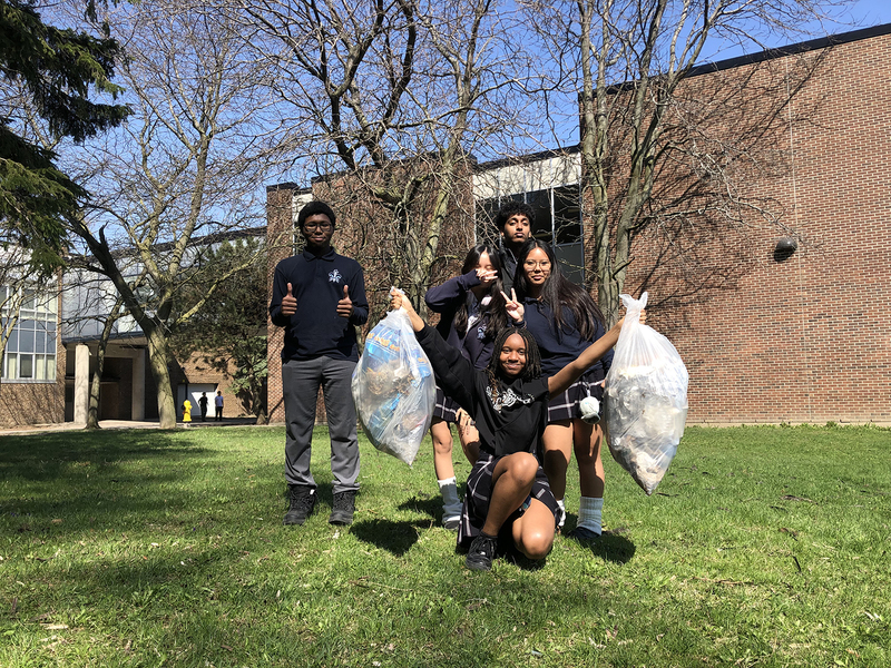 Photo of SJOA students with the garbage they cleaned up