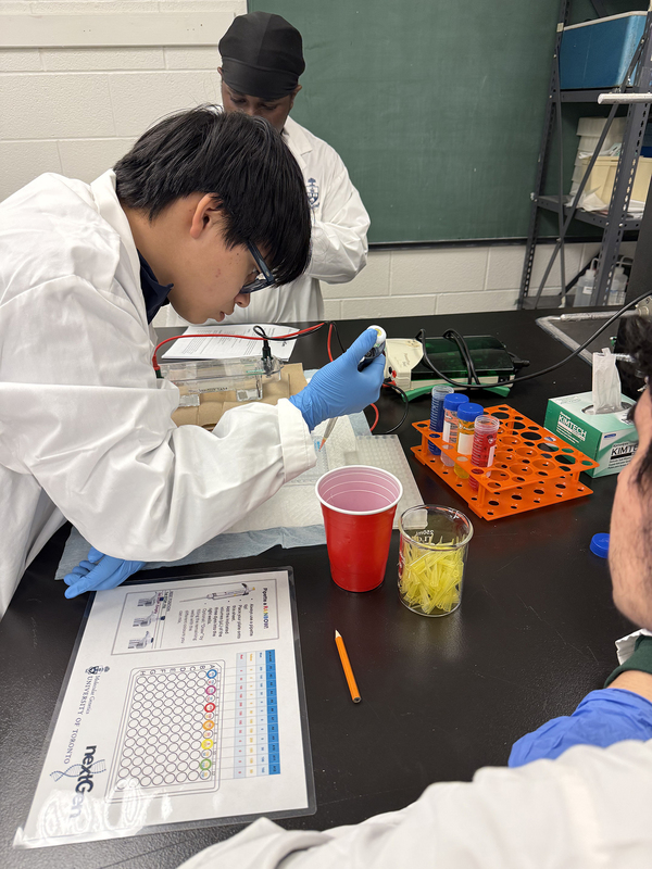 Photo of JCM student in the lab working on experiment during the excursion