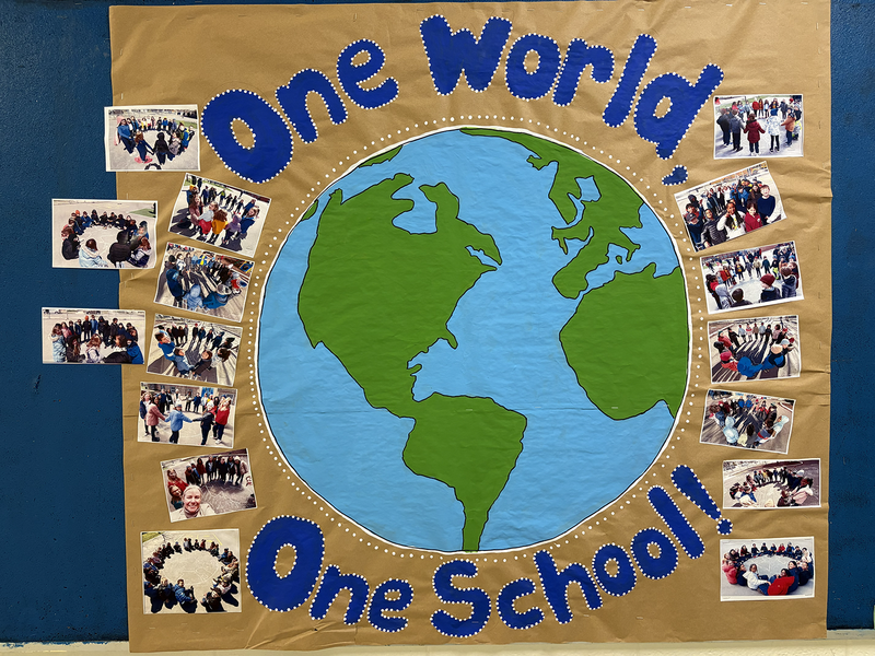 One World, One School St. Brigid poster with photos of the school celebrations during the week