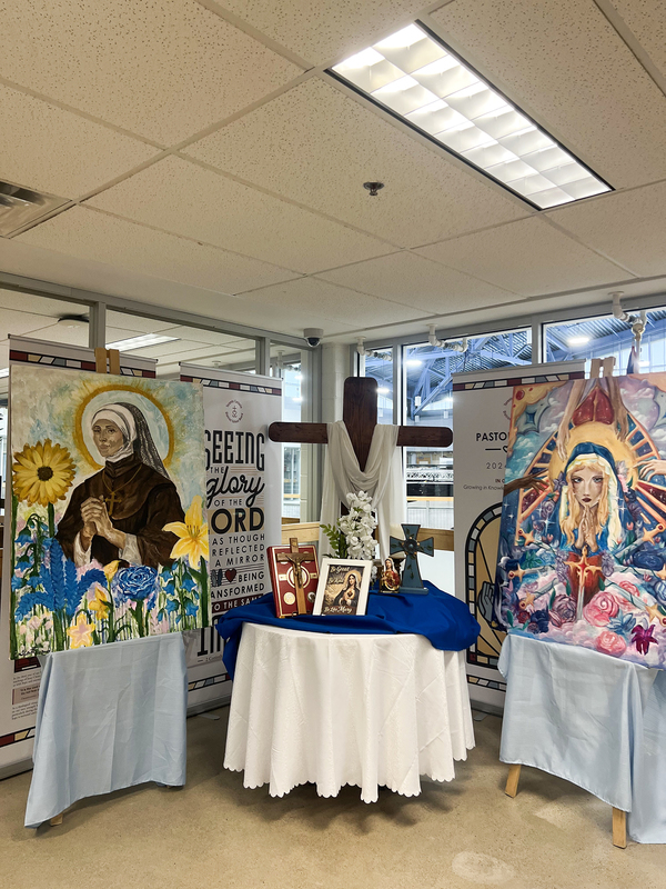 Photo of the two murals on display