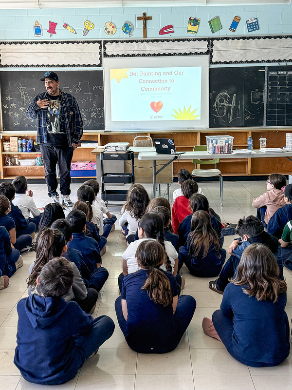 Photo of St. John Bosco students listening to Jason and his presentation