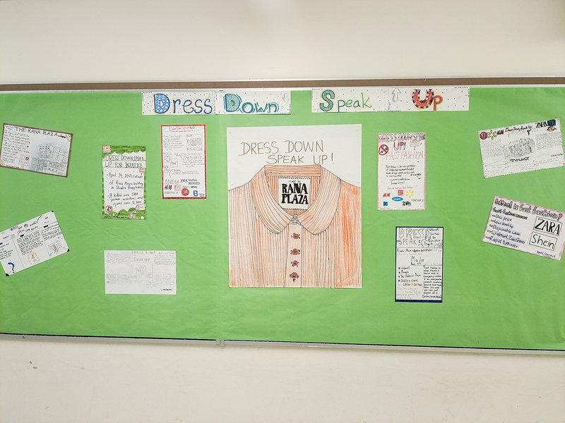 Bulletin board display explaining the initiative with accompanying artwork