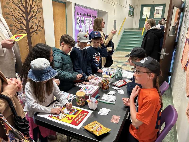 Photo of St. Cecilia students doing activities at Math Night