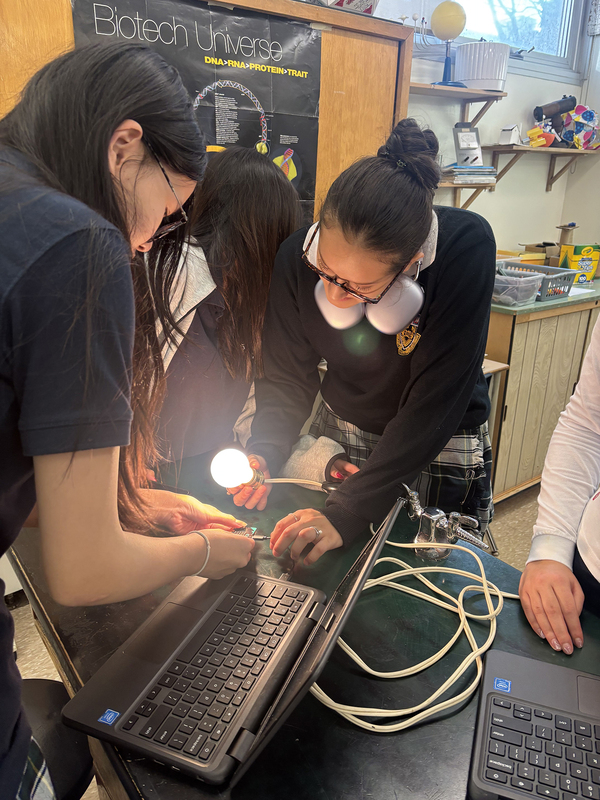 Collage of three photos of SJCS students working on their project with the help of their teacher