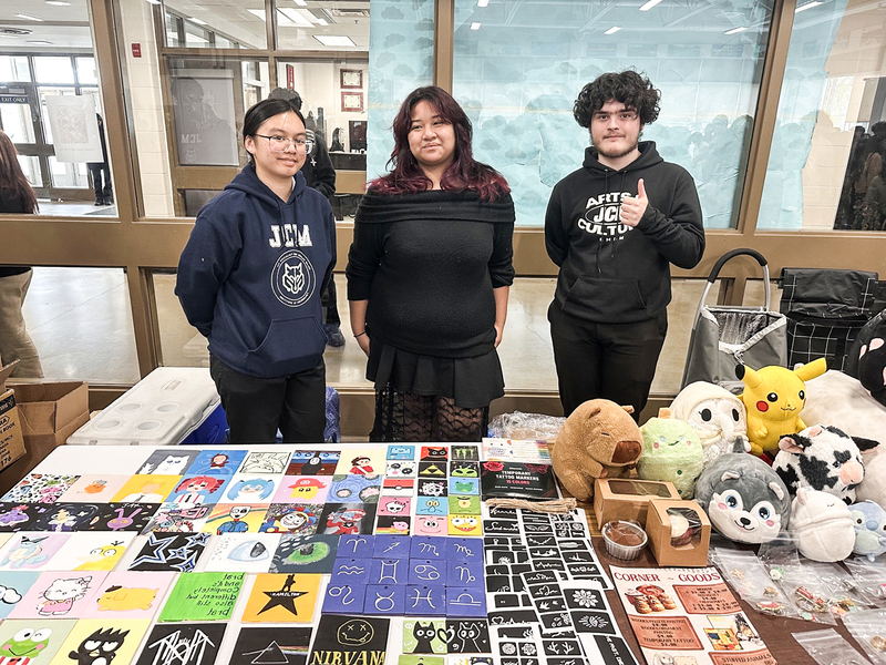 Photo of JCM students with their wares at the marketplace