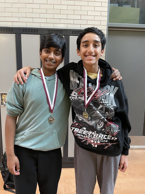 Photo of Aidan D. and Nishi S. with their medals