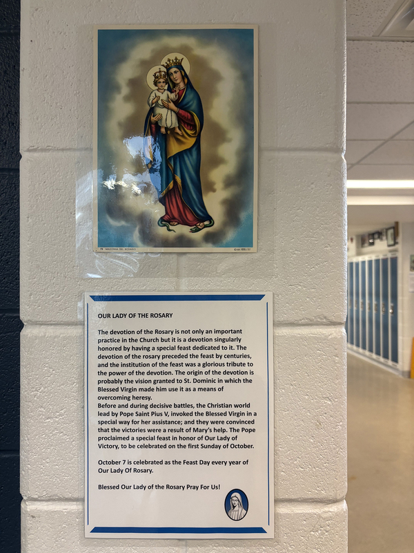 One of the stations during the walk with a painting of Mary and related information