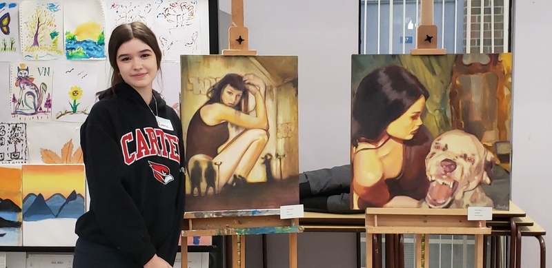 Students showcase art exhibits at Piece Out presentation while members of the school community look at the art Students showcase art exhibits at Piece Out presentation while members of the school community look at the art