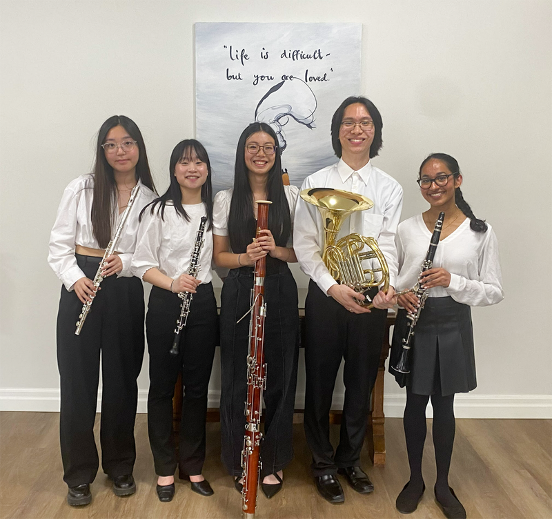 Group photo of the Cardinal Carter Senior Woodwind Quintet posing with their instruments Group photo of the Cardinal Carter Senior Woodwind Quintet posing with their instruments